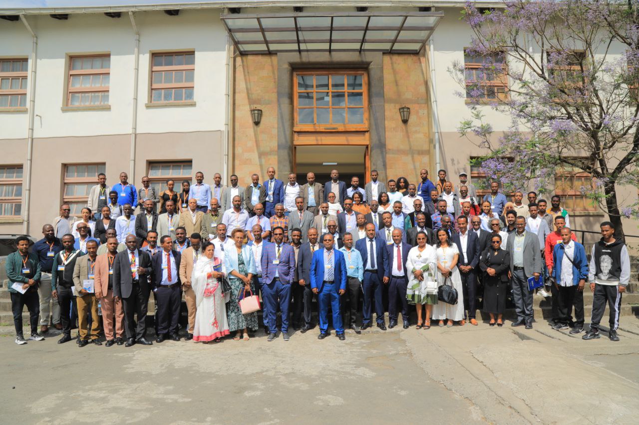 Large group photo of conference participants